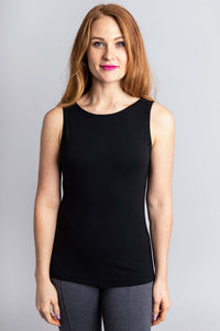 Front view of a woman in a black bamboo tank top with a scoop neckline