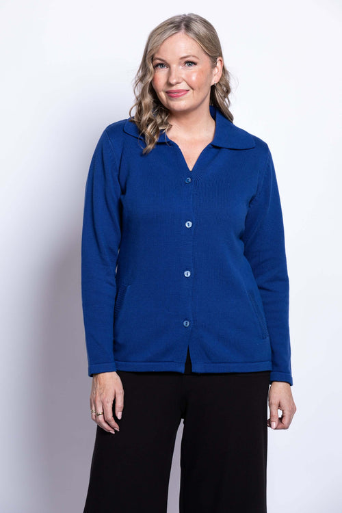 Woman wearing a blue button-up cotton cardigan with collar, front view
