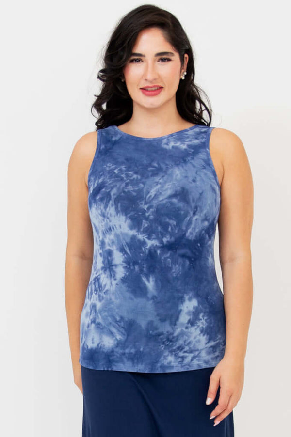 Front view of model wearing blue tie-dye reversible bamboo tank with round neck