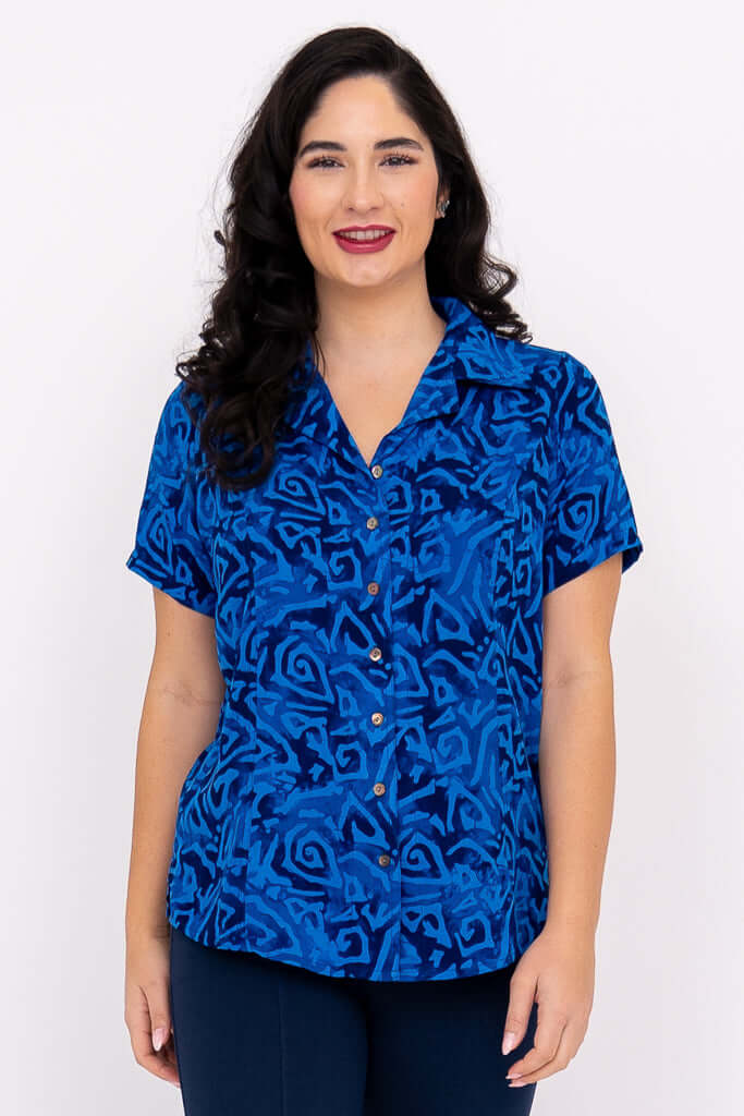 Front view of woman wearing Aida Top in blue swirl print