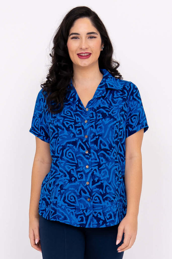 Front view of woman wearing Aida Top in blue swirl print