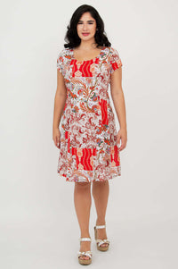 Woman modeling Anna dress with red paisley print, front view