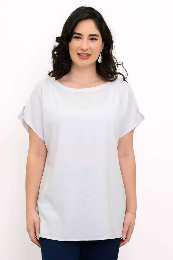 Front view of woman wearing a white linen blend tee with dolman cap sleeves