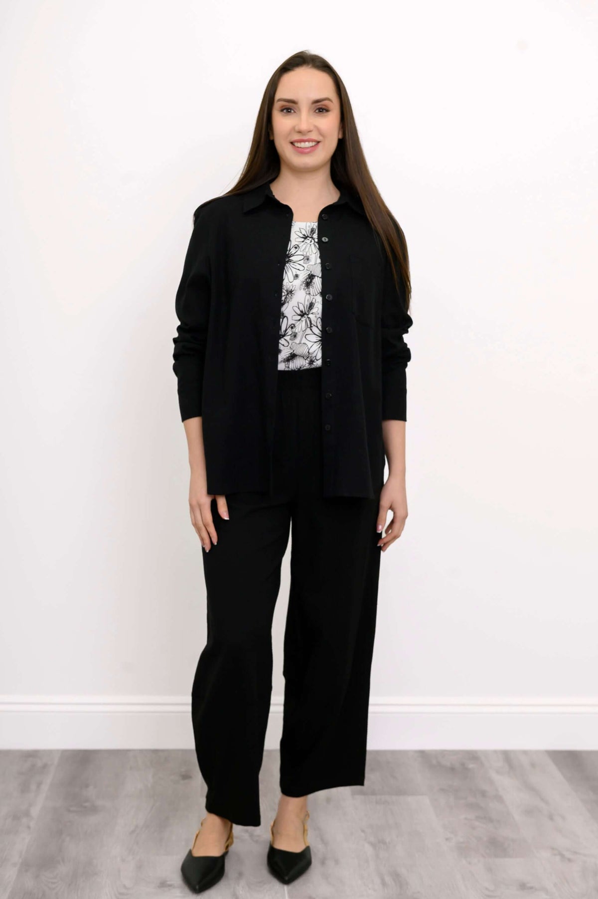 Front view of Boardwalk Pants styled with a patterned top and black jacket