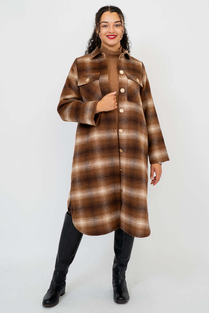 Front view of model wearing a brown plaid wool-blend knee-length coat