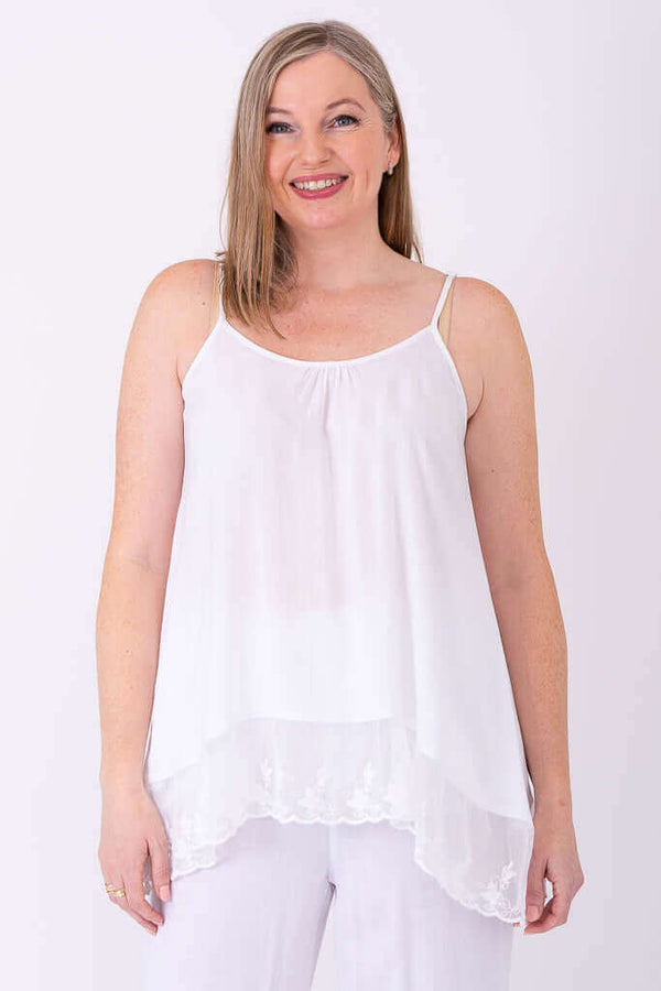 Front view of woman wearing white Chantilly Lace Tank with lace hem