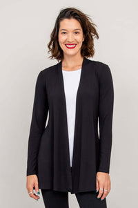 Front view of woman wearing black A-line bamboo Chopra jacket with long sleeves