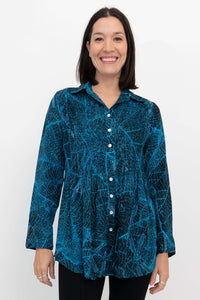 Front view of model wearing Cindy long sleeve blue leaf print top