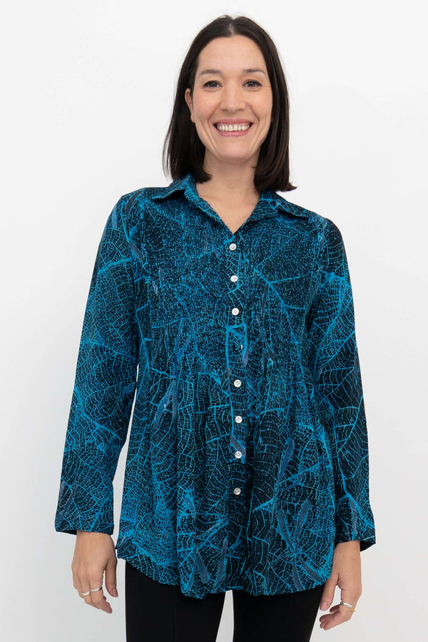 Front view of model wearing Cindy long sleeve blue leaf print top
