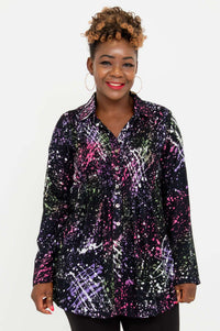 Front view of a woman wearing the Cindy smocked long sleeve shirt with colorful abstract print