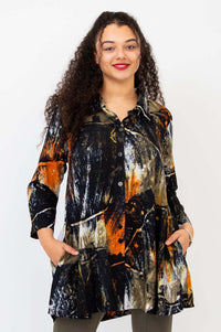 Front view of model wearing the Cissy Long Sleeve Top with abstract black, orange, and beige print