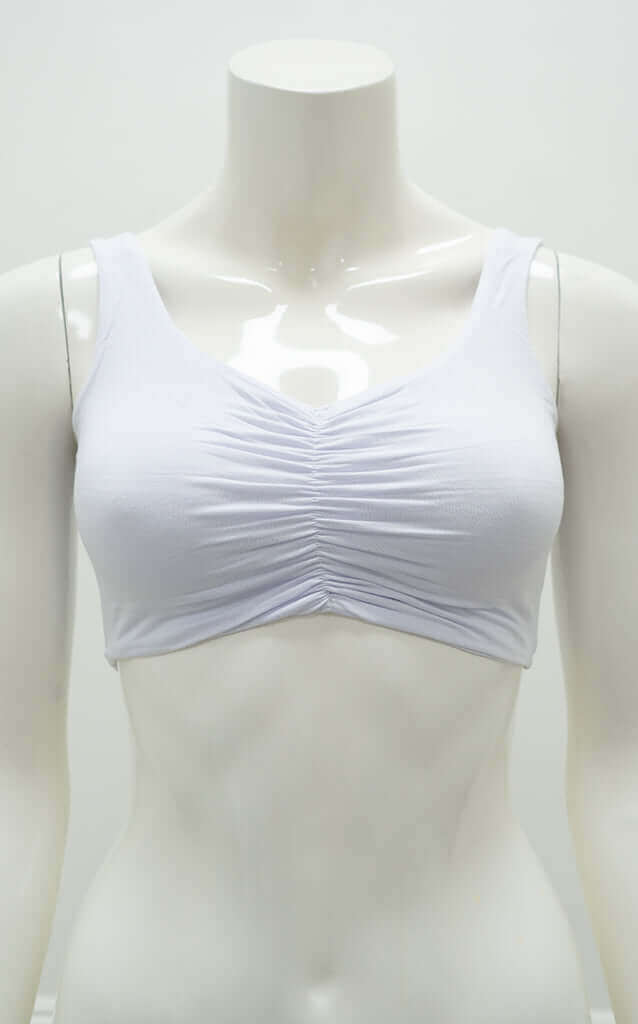 Front view of the Clipper Top in white with cinched neckline on mannequin