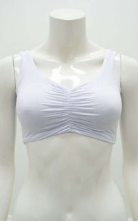 Front view of the Clipper Top in white with cinched neckline on mannequin