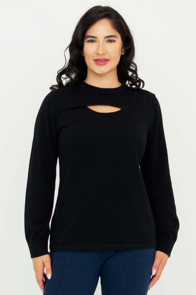 Front view of model wearing a black sweater with unique neck cutout and long sleeves