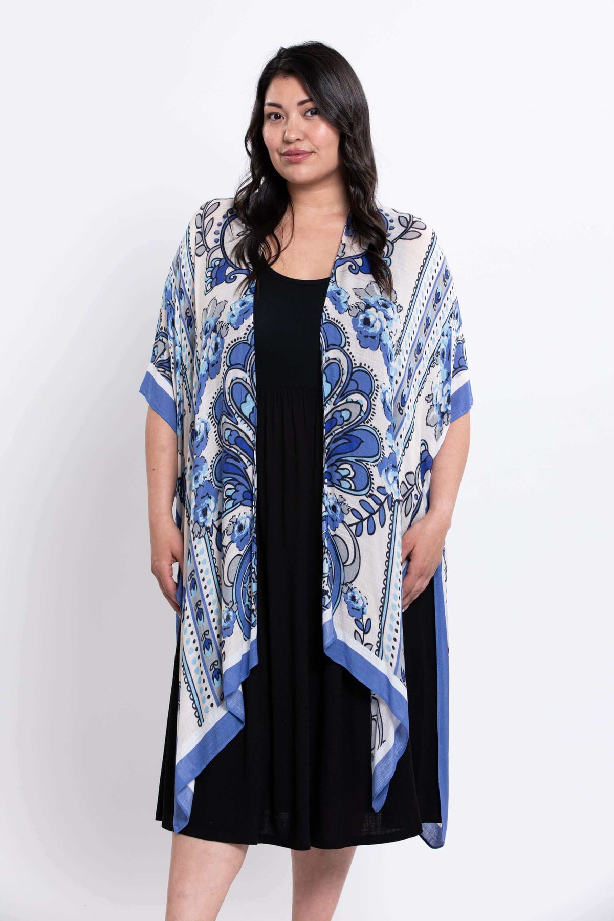Front view of a woman wearing the Darcy kimono wrap with blue floral pattern