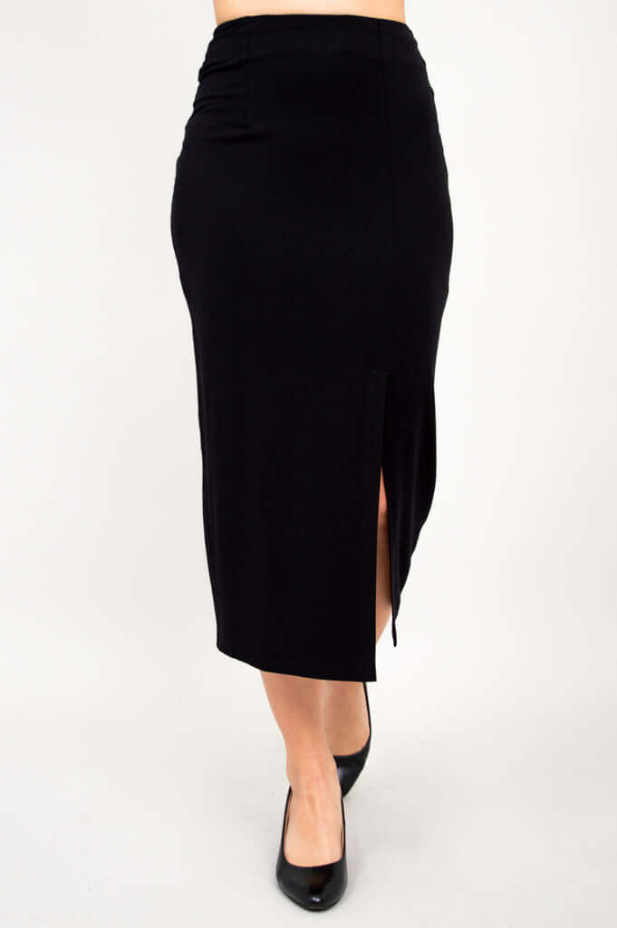 Front view of Eva long black slim skirt with a side slit