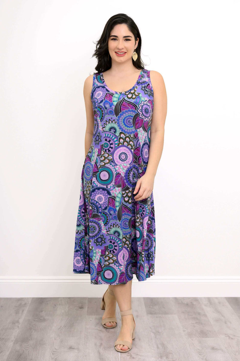 Front view of a woman wearing a vibrant purple and blue patterned tank dress