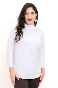 Front view of a woman wearing a white mock neck 3/4 sleeve top