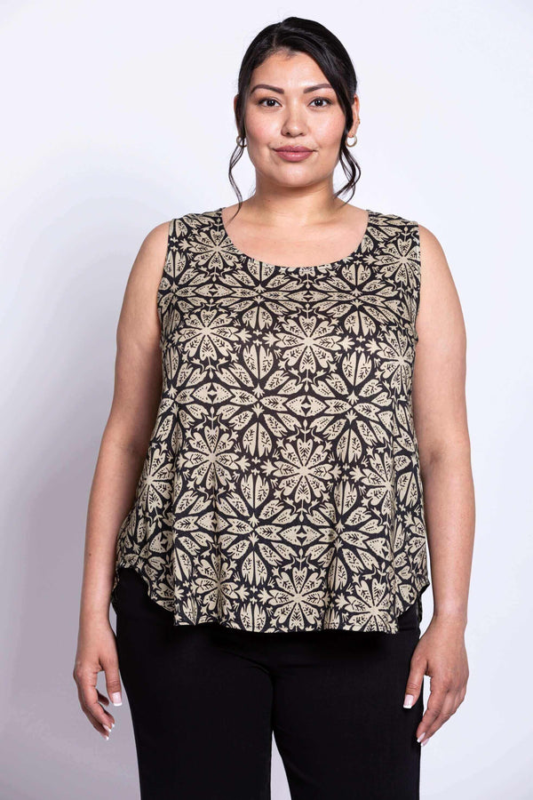 Front view of model wearing black and beige floral print top and black pants