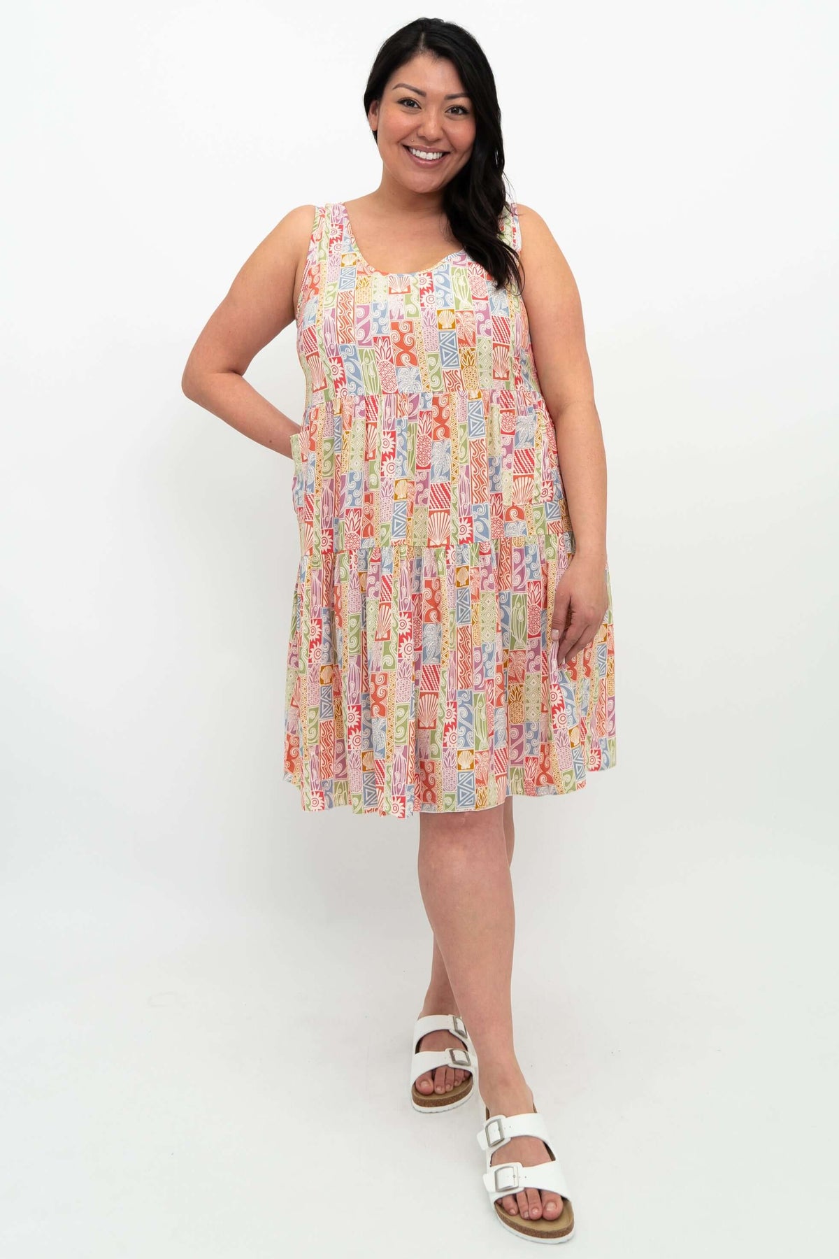 Front view of model wearing the Kayana dress in colorful geometric pattern