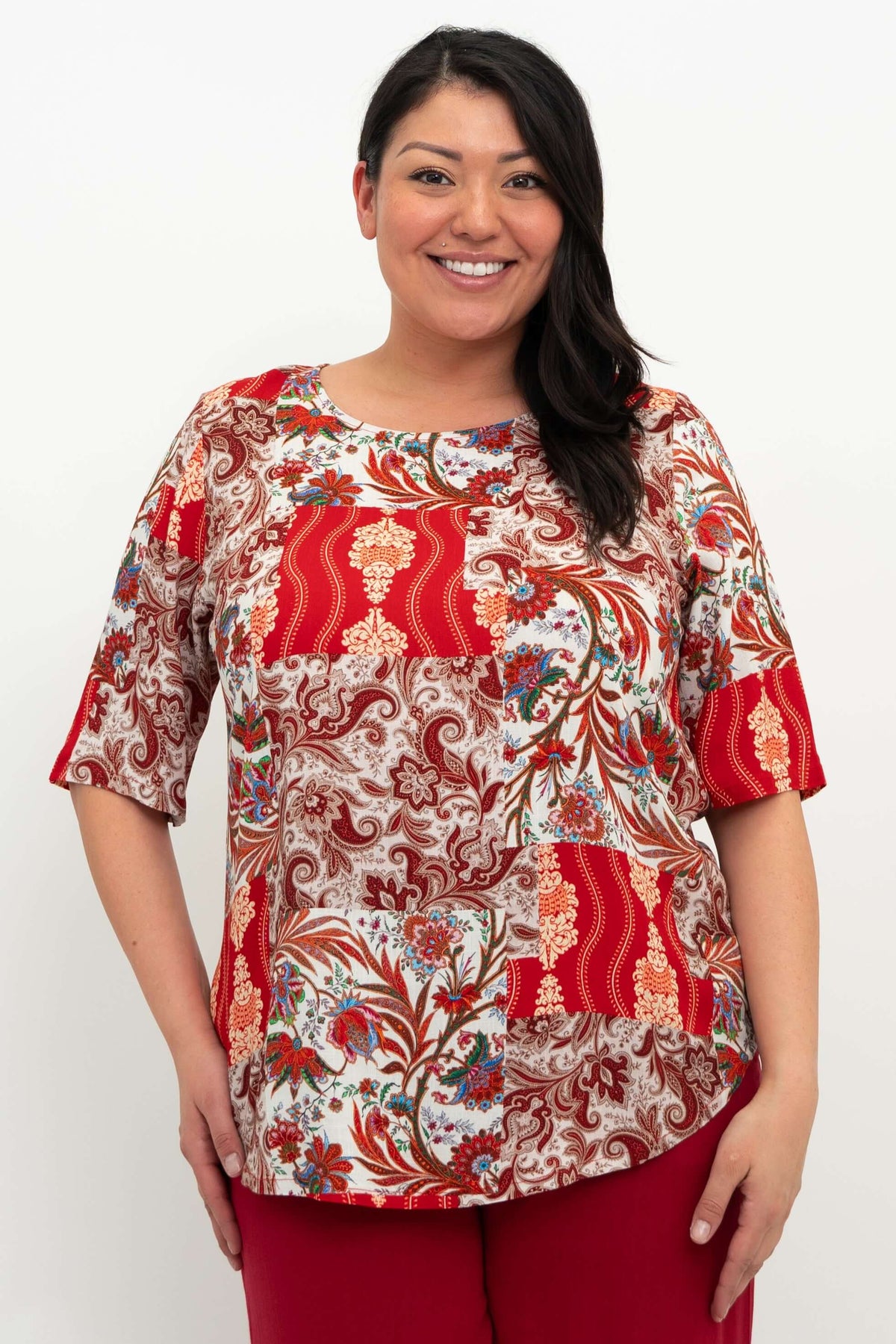 Front view of model wearing Liza paisley patchwork blouse with elbow-length sleeves