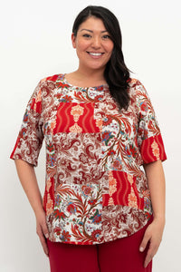 Front view of model wearing Liza paisley patchwork blouse with elbow-length sleeves