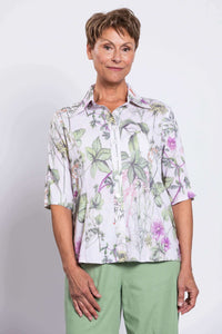 Front view of woman wearing Lorine bamboo linen blouse with botanical print