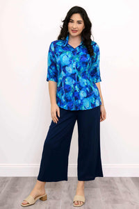 Front view of Lorine blue blouse with navy wide-leg pants and sandals