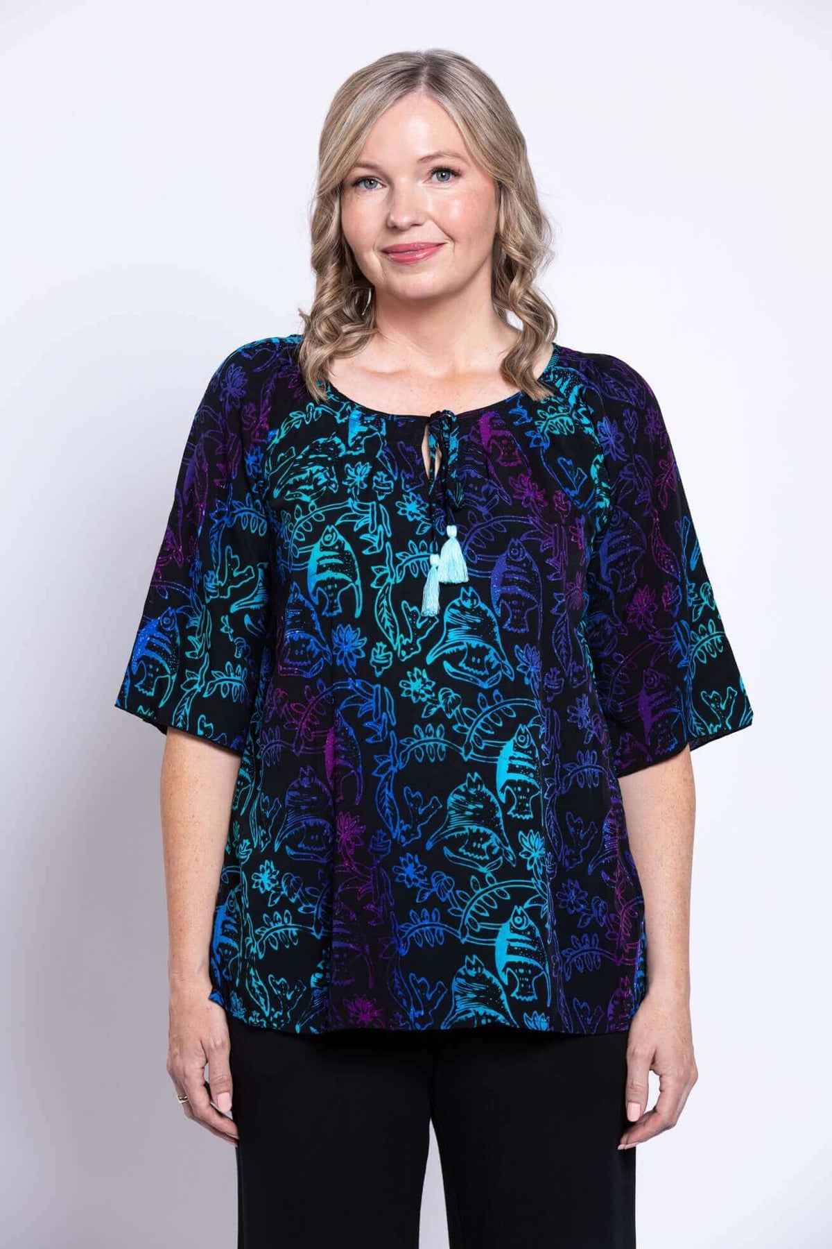 Front view of model wearing the Luna Boho Peasant Top with tie-front detail