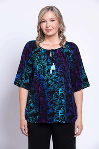 Front view of model wearing the Luna Boho Peasant Top with tie-front detail