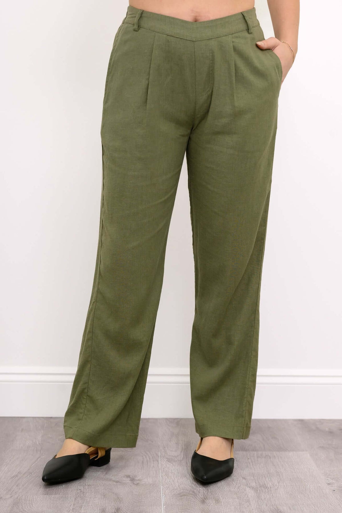 Front view of model wearing olive green linen blend Melodie Pant with pleats and pockets