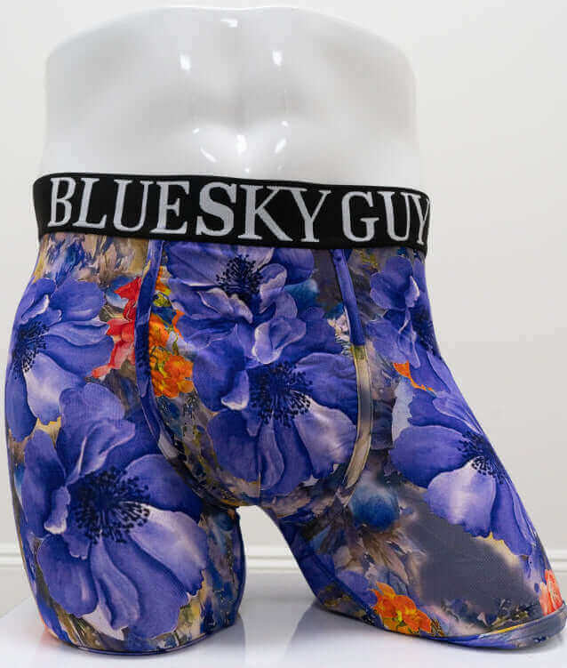 Front view of men's bamboo boxer briefs with bold blue floral print and BLUE SKY GUY waistband