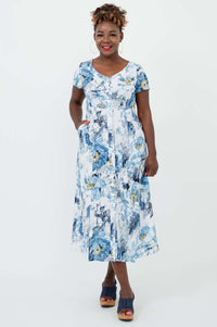 Front view of model wearing Morgan dress in blue and white watercolor floral print