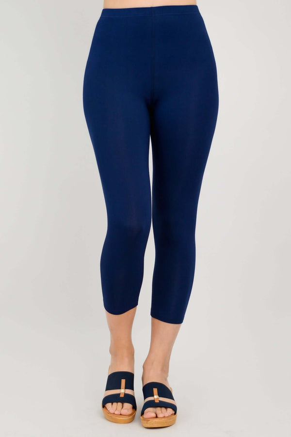 Front view of Ruby bamboo capri leggings in navy, model standing