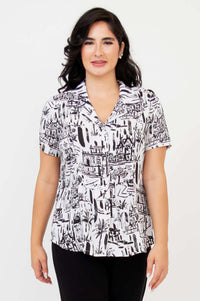 Front view of woman wearing Samantha black and white print short sleeve shirt