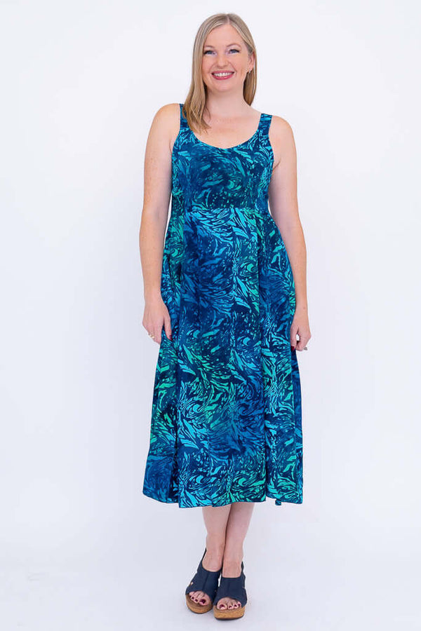 Front view of woman in Shauna empire waist blue A-line midi dress