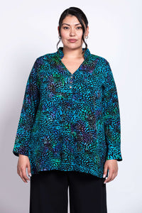 Front view of model wearing Shirley Blouse in blue and green printed rayon