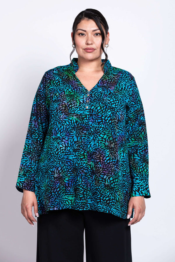 Front view of model wearing Shirley Blouse in blue and green printed rayon