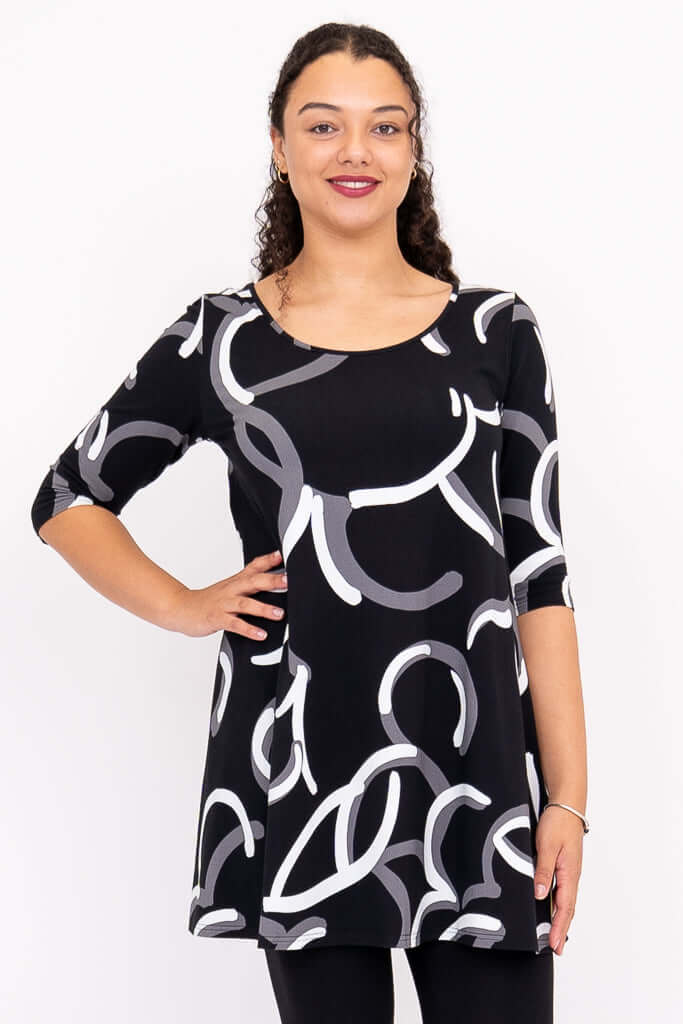 Front view of model wearing Spirit Dress in black with white and grey abstract pattern and 3/4 sleeves