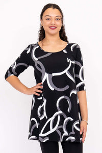 Front view of model wearing Spirit Dress in black with white and grey abstract pattern and 3/4 sleeves