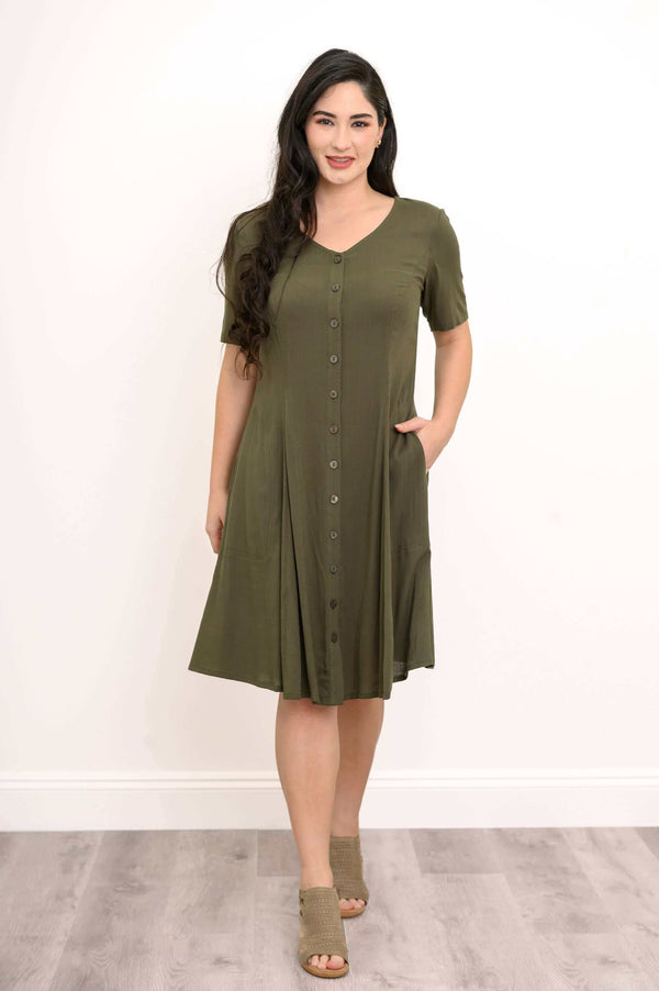 Front view of woman wearing olive green short sleeve button-front dress with pockets