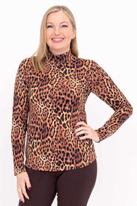 Front view of woman wearing a leopard print long sleeve mock neck top