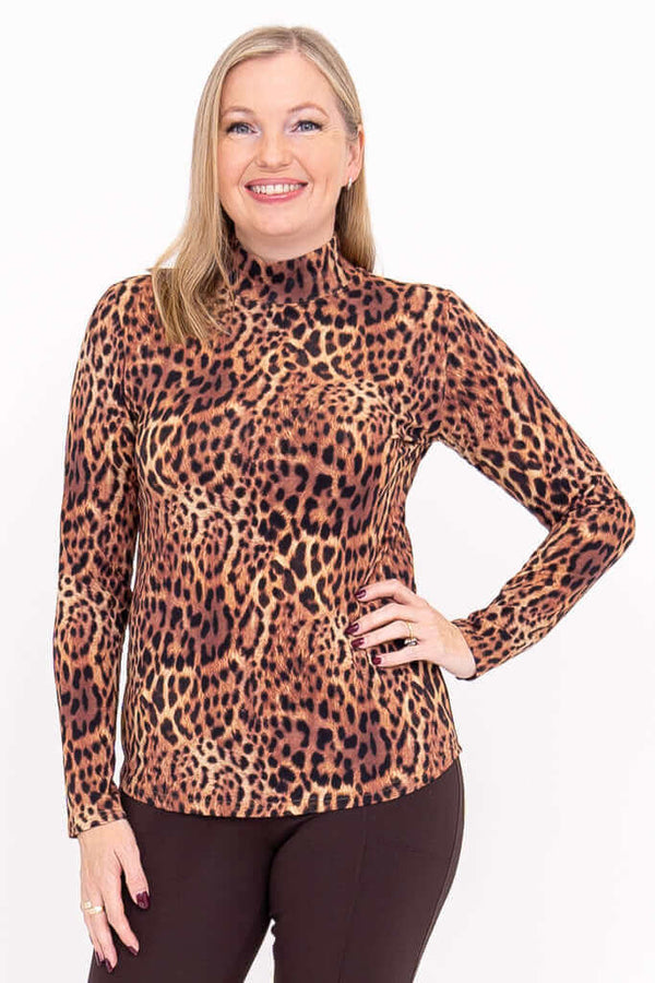 Front view of woman wearing a leopard print long sleeve mock neck top