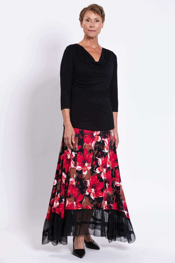 Front view of model wearing Vera floral maxi skirt with mesh hem