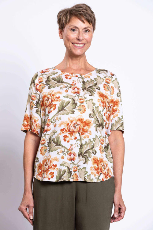Front view of a woman wearing a floral print short sleeve blouse