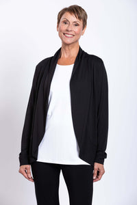 Woman wearing a black French Terry jacket over a white top, front view