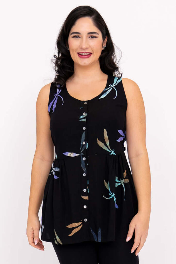 Front view of woman wearing a black batik tank top with button front and colorful dragonfly print