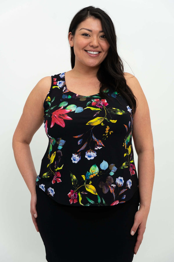 Woman wearing a black floral tank top with a sweetheart neckline, shown from the front