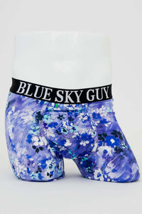 Front view of blue and white floral bamboo boxer briefs with black waistband that reads BLUE SKY GUY