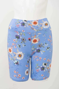 Front view of blue bamboo shorts with a colorful floral print